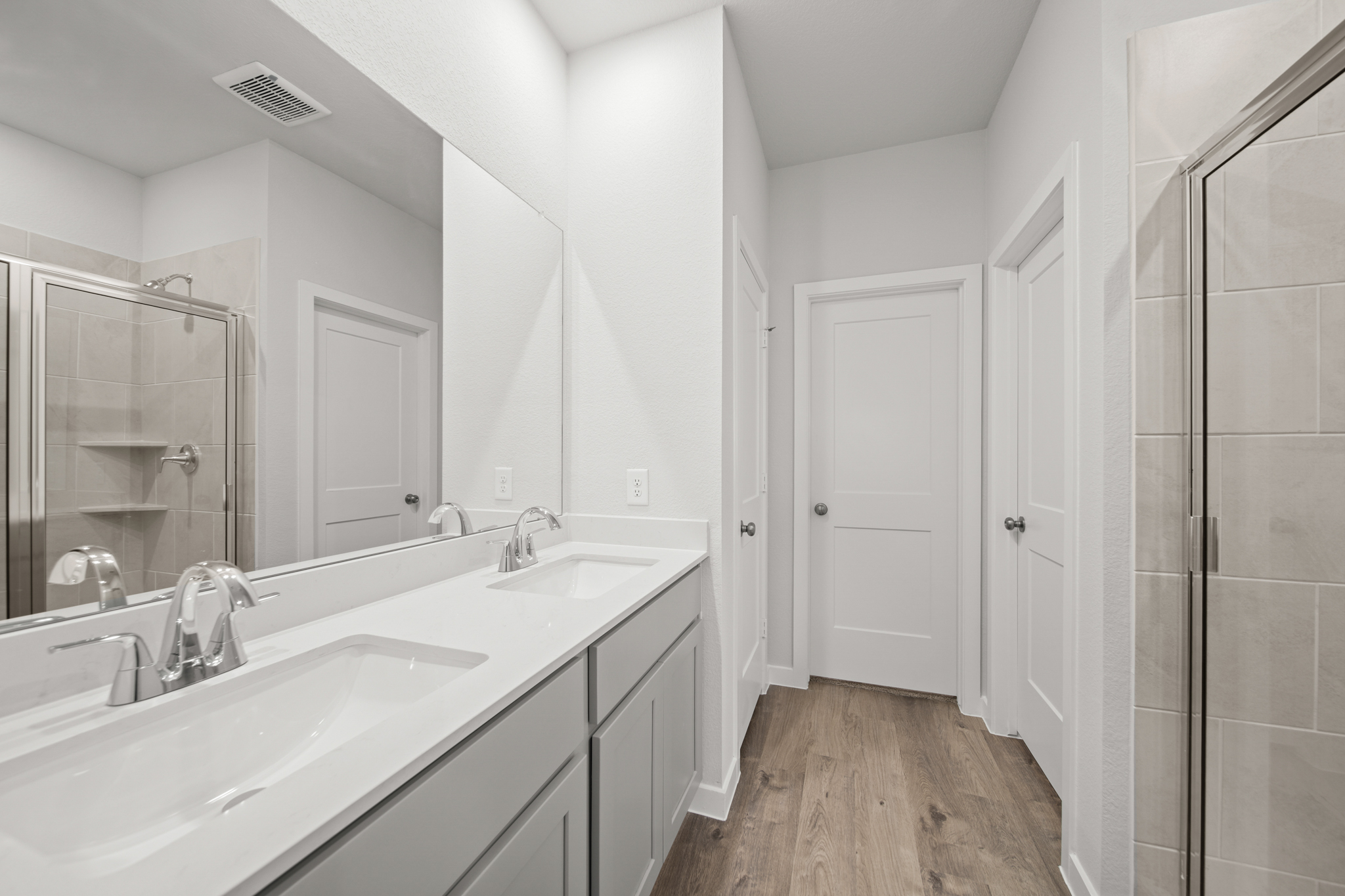 A bathroom with a glass shower.