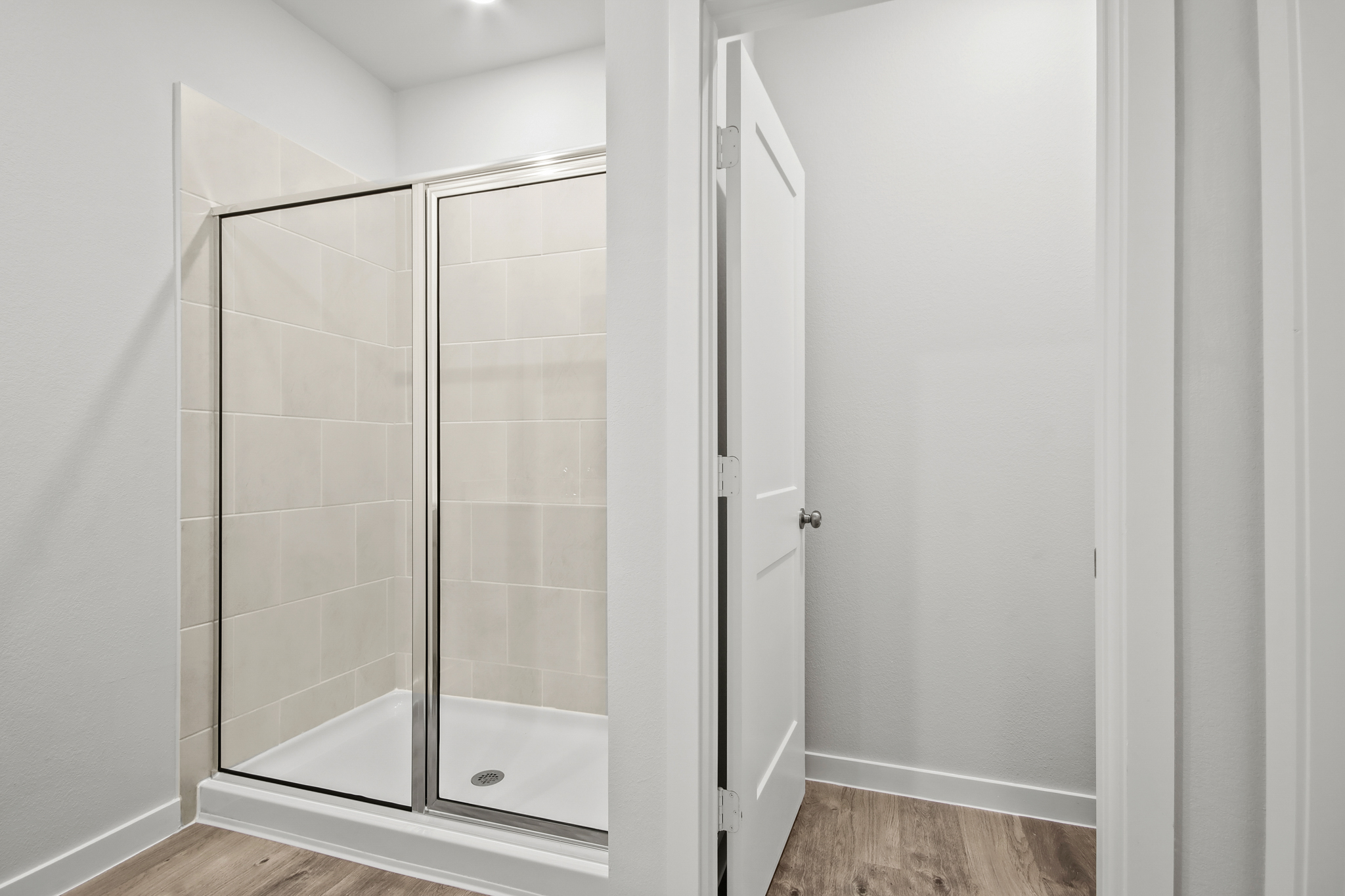 A shower unit in a bathroom.