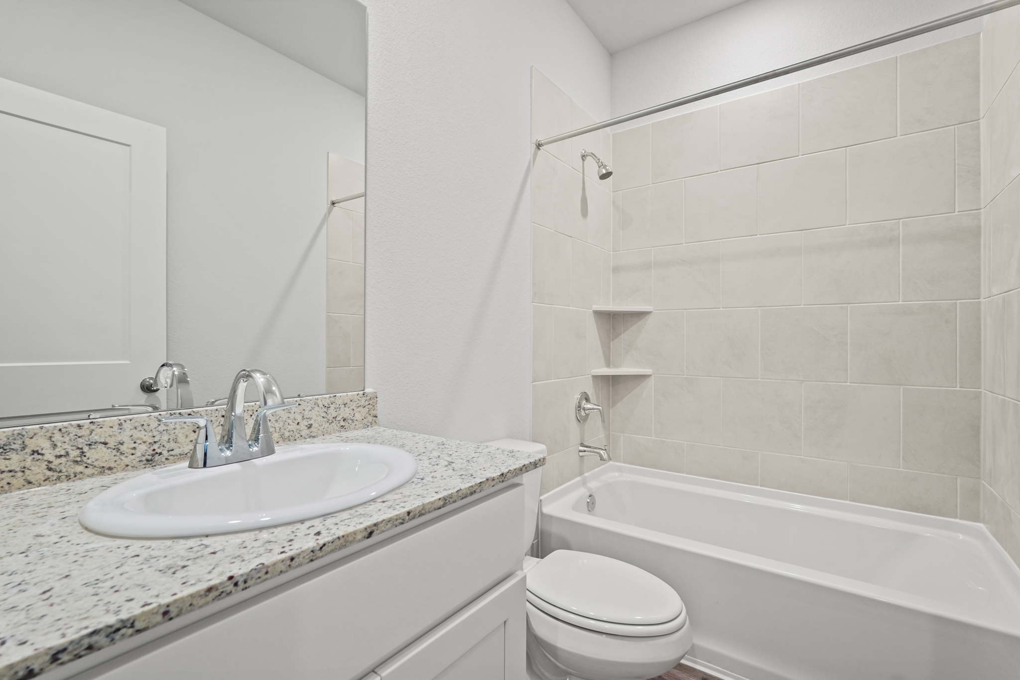 A bathroom with a sink and a tub.