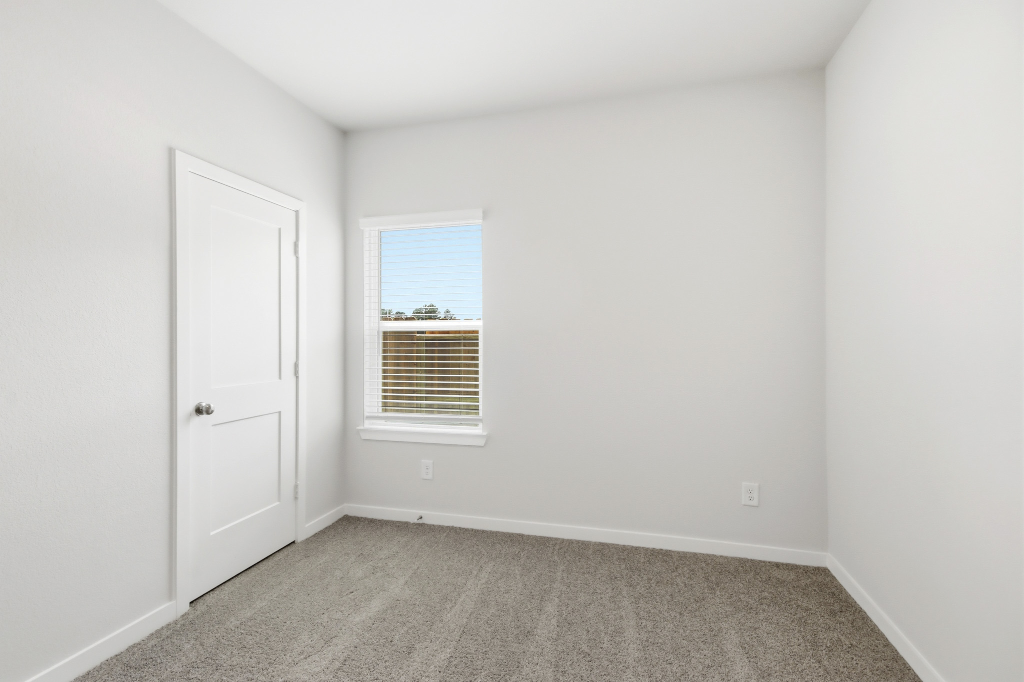 A room with a door and a window.