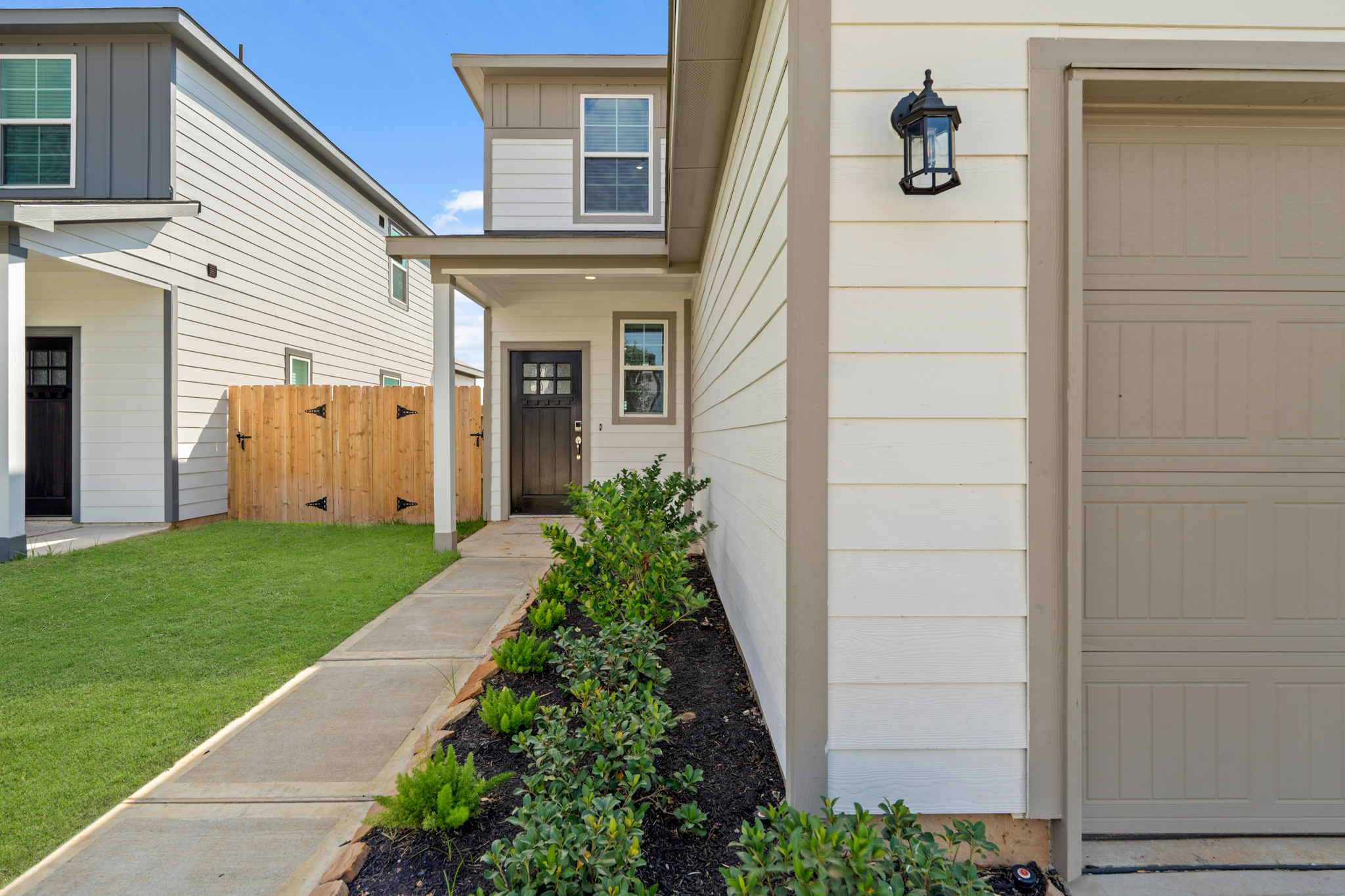 A house with a fence and a yard.