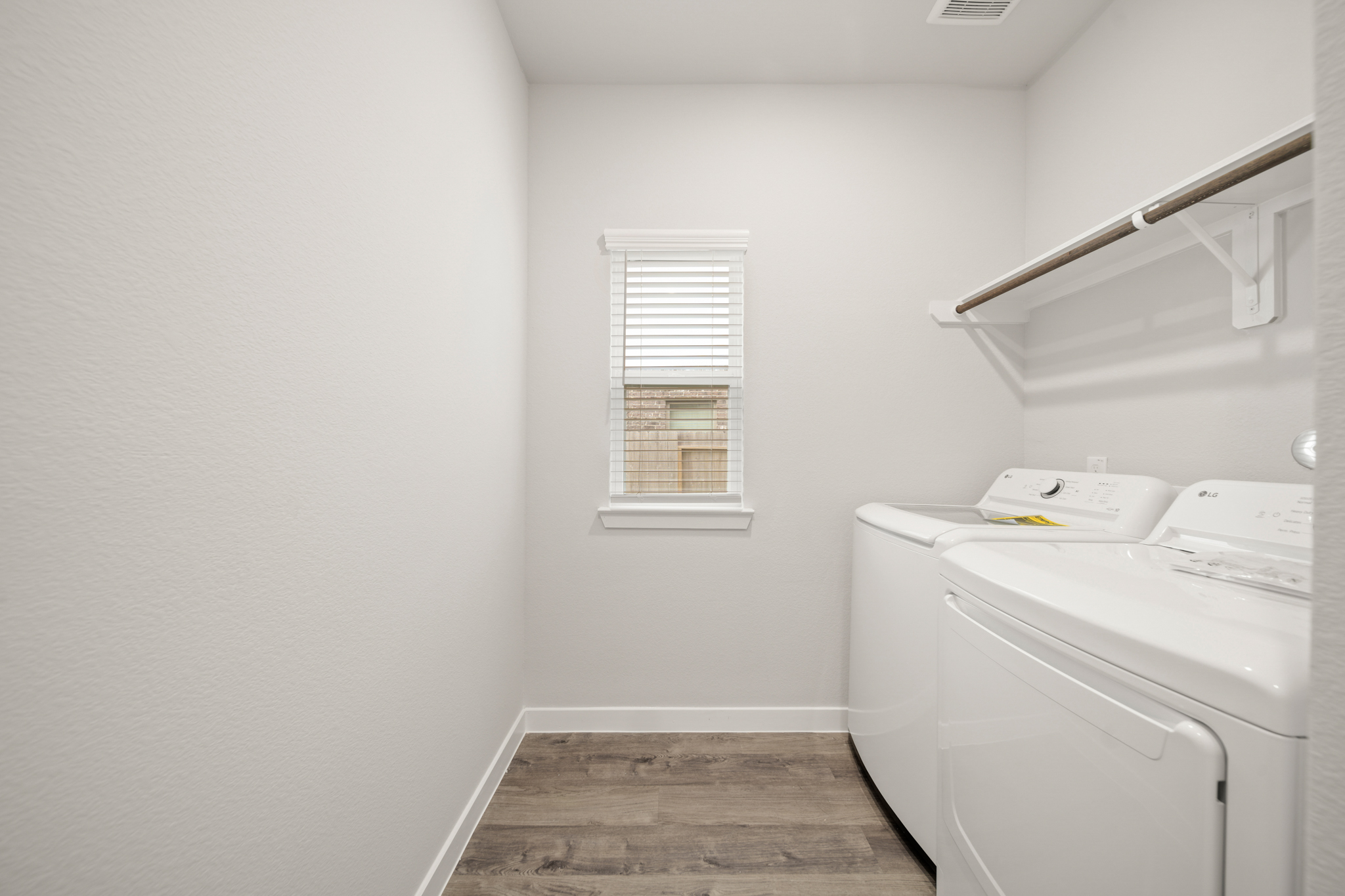 A room with a desk and a window.