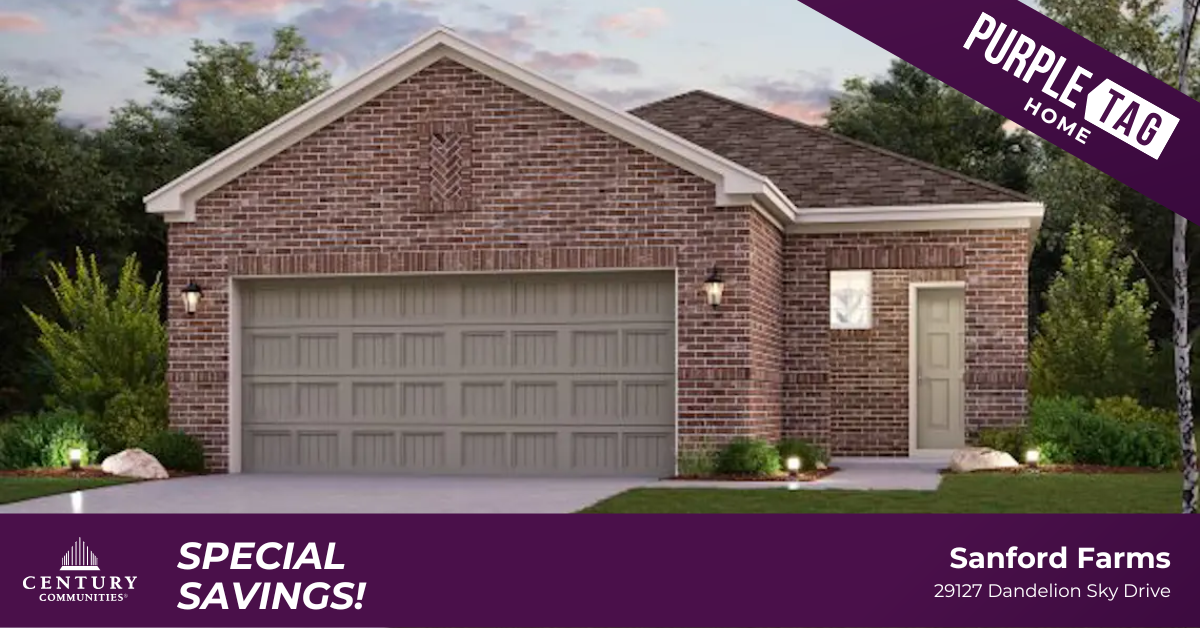 A brick house with a garage.