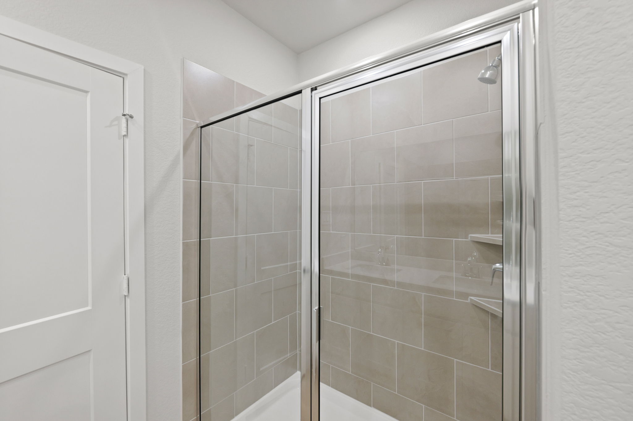 A shower unit in a bathroom.