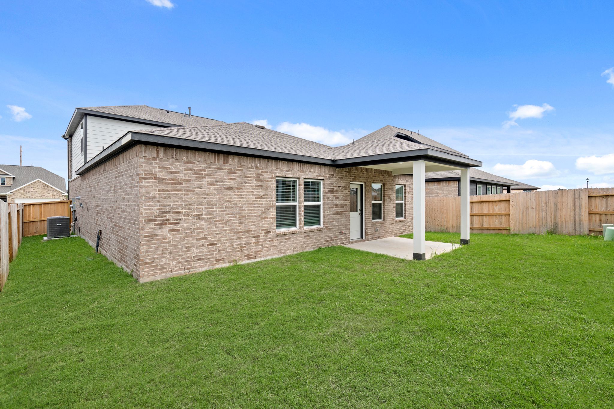 A house with a green lawn.