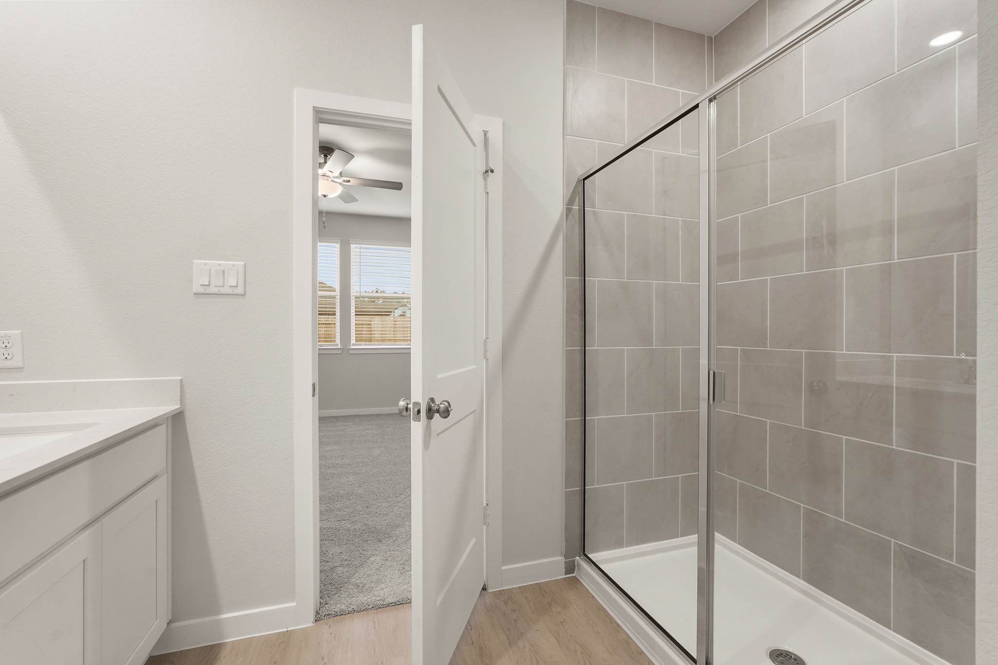 A bathroom with a glass shower.