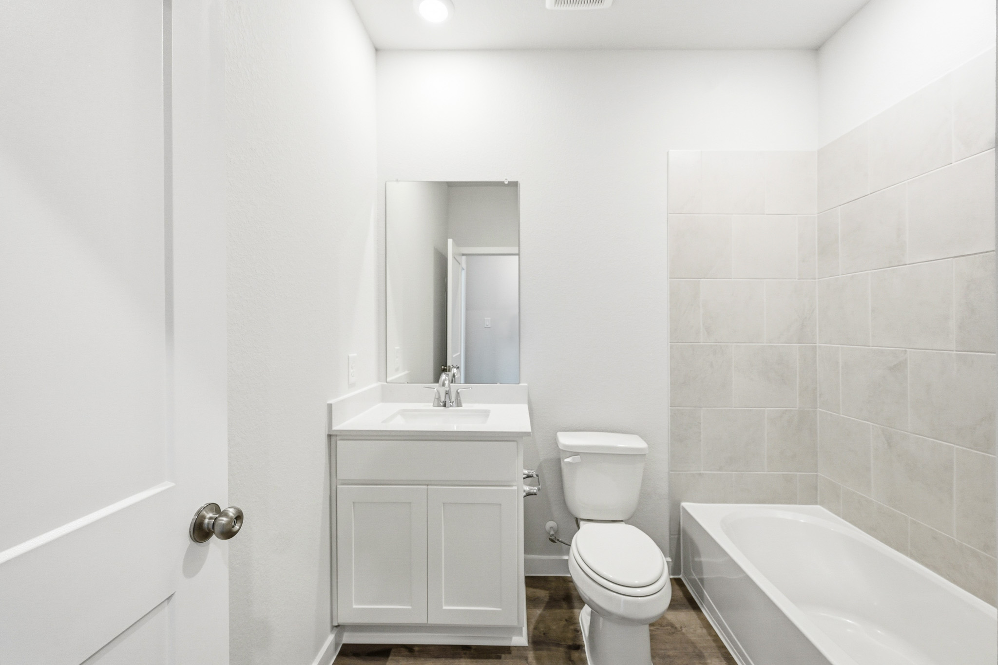 A bathroom with a toilet and sink.