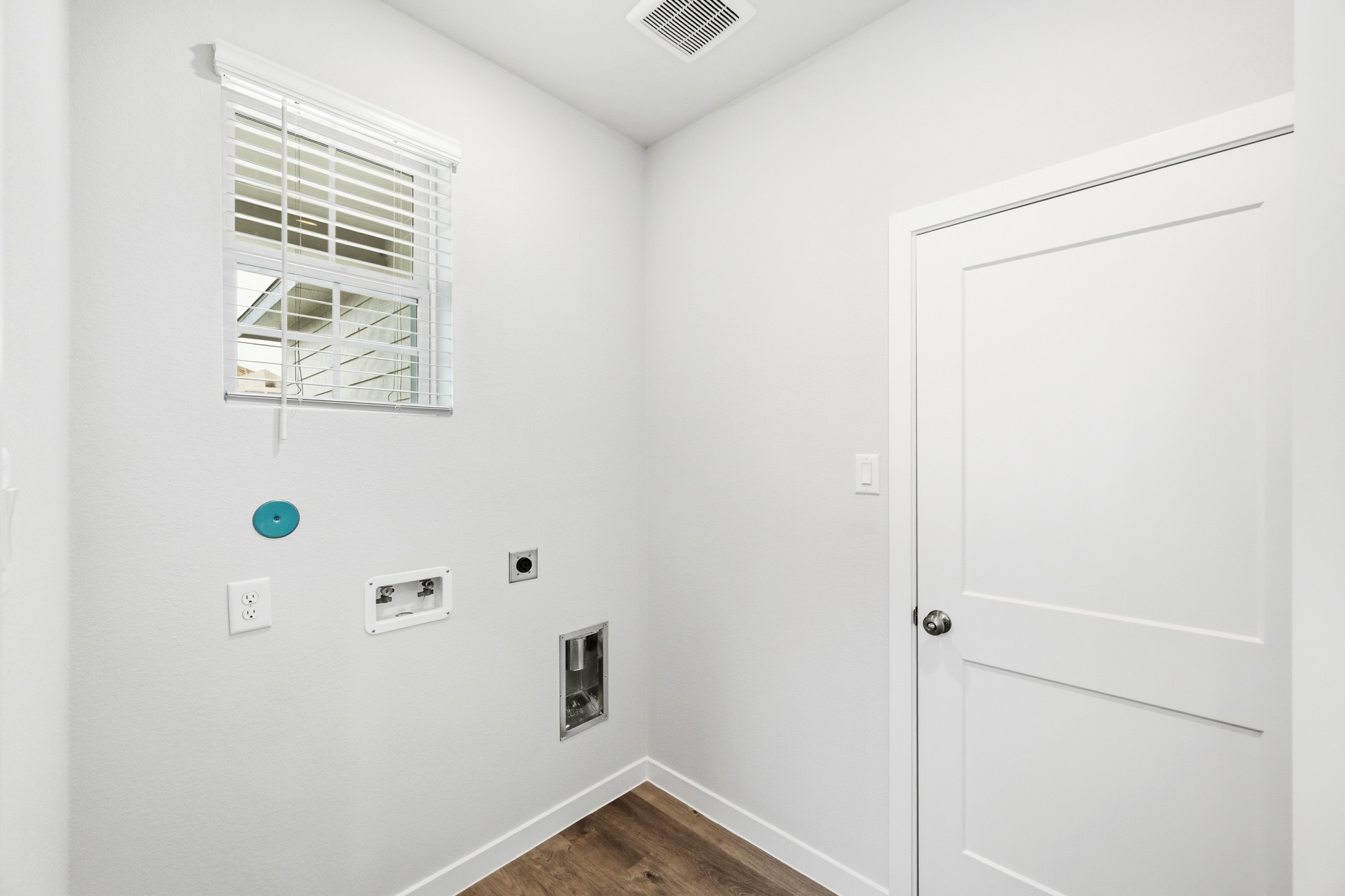 A white door with a window.
