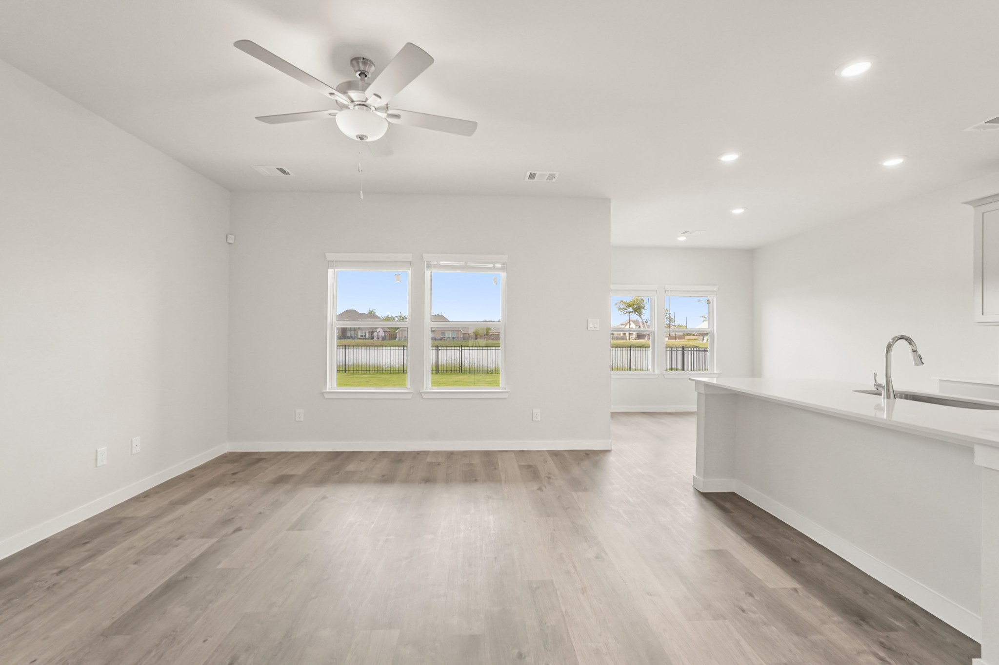 A kitchen with a large window.