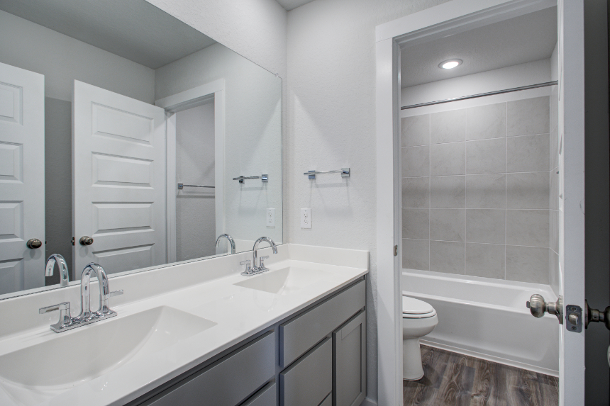 A bathroom with a sink and a toilet.
