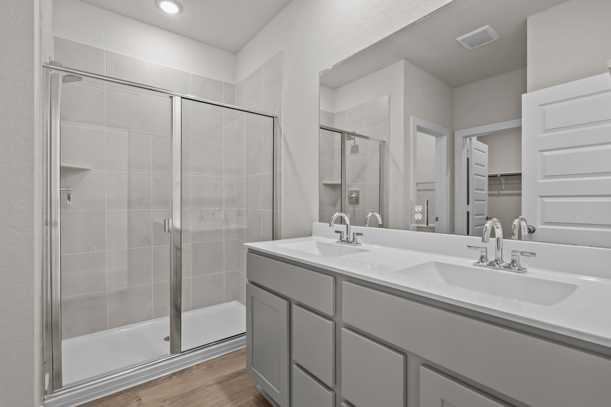 A bathroom with a glass shower.