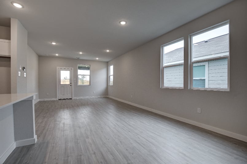 A large empty room with windows.