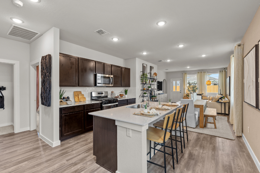 A kitchen with a dining table.