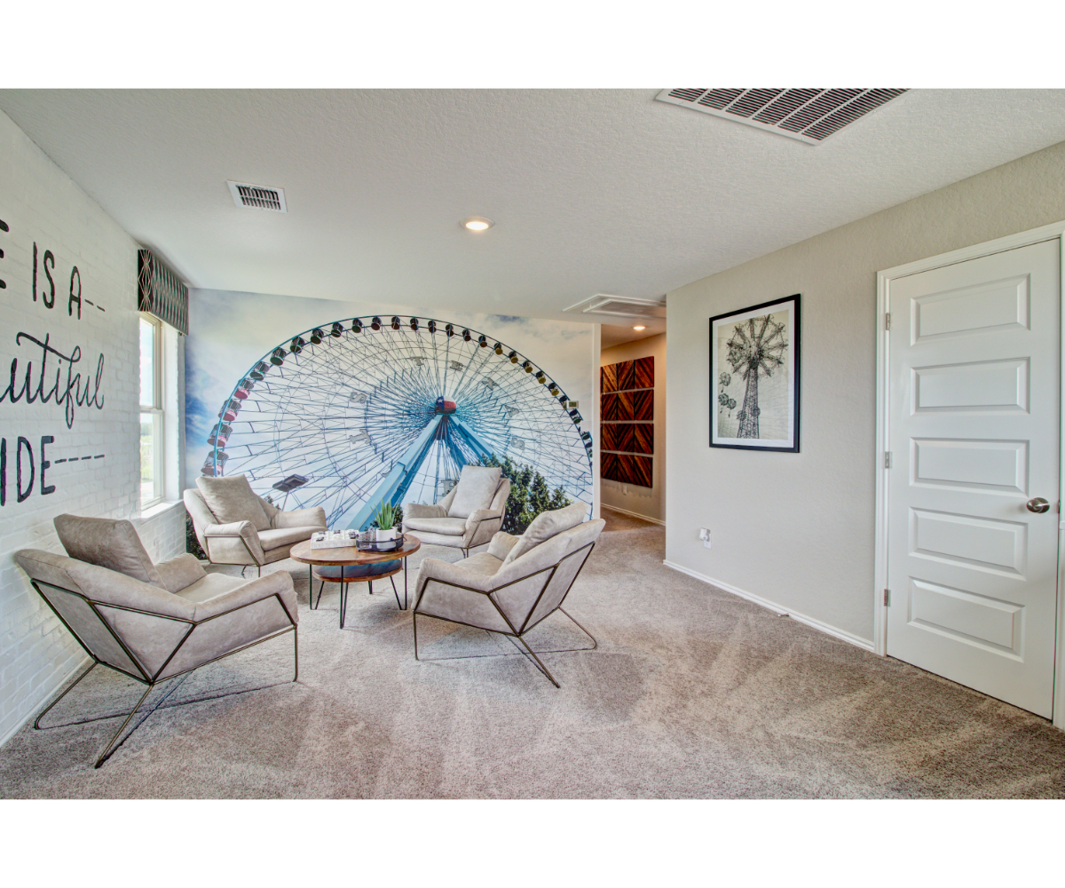 A living room with a large round window.