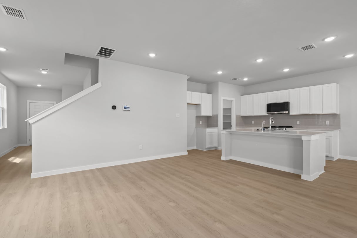 A large kitchen with white cabinets.