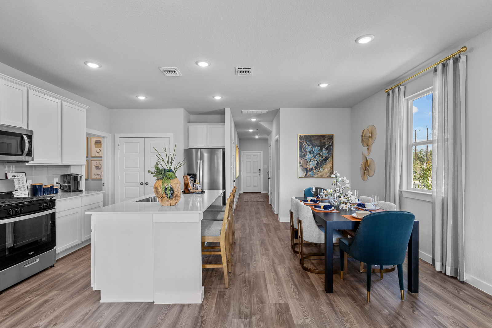 A kitchen with a dining table.