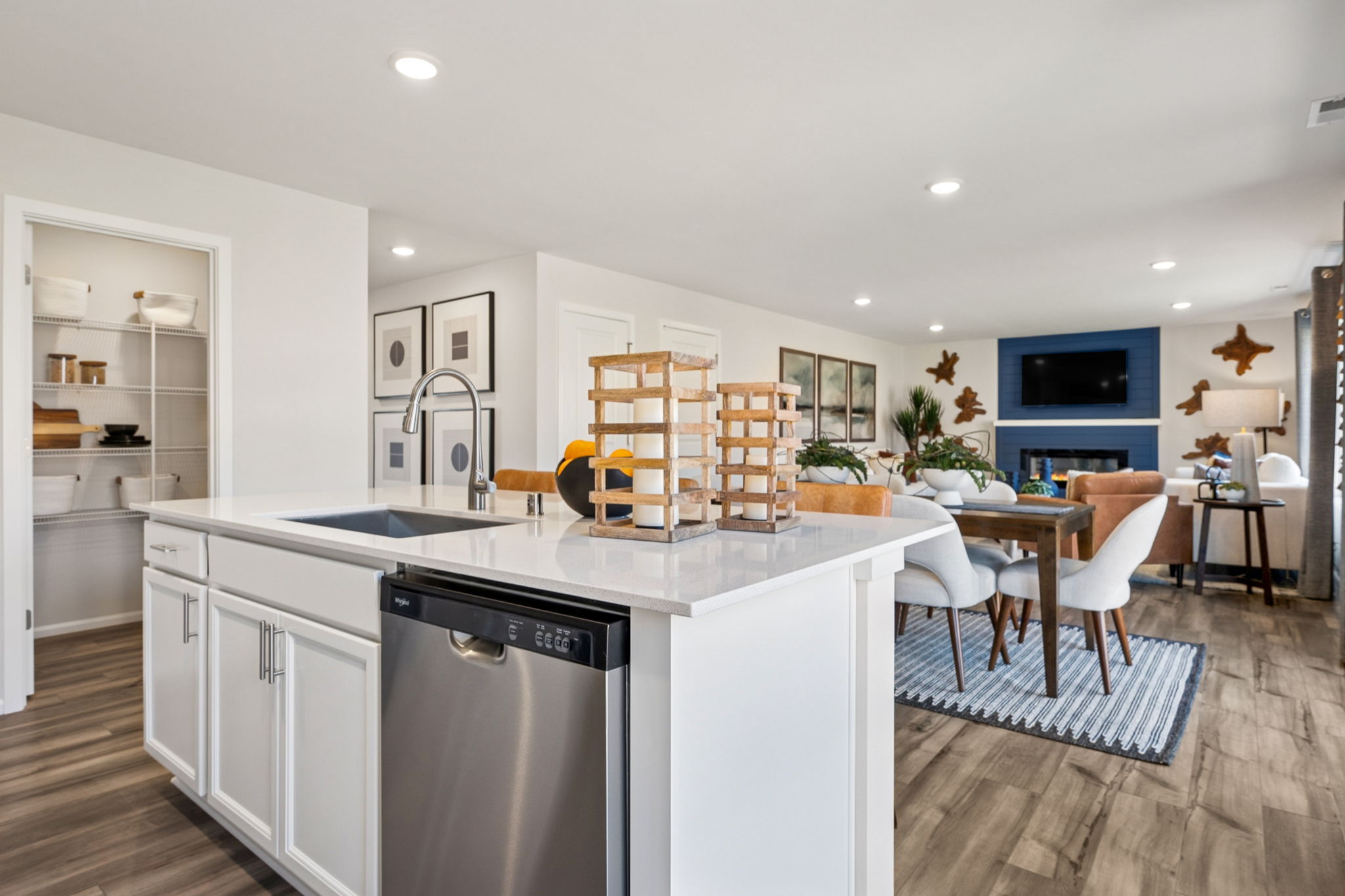 A kitchen with a table and chairs.