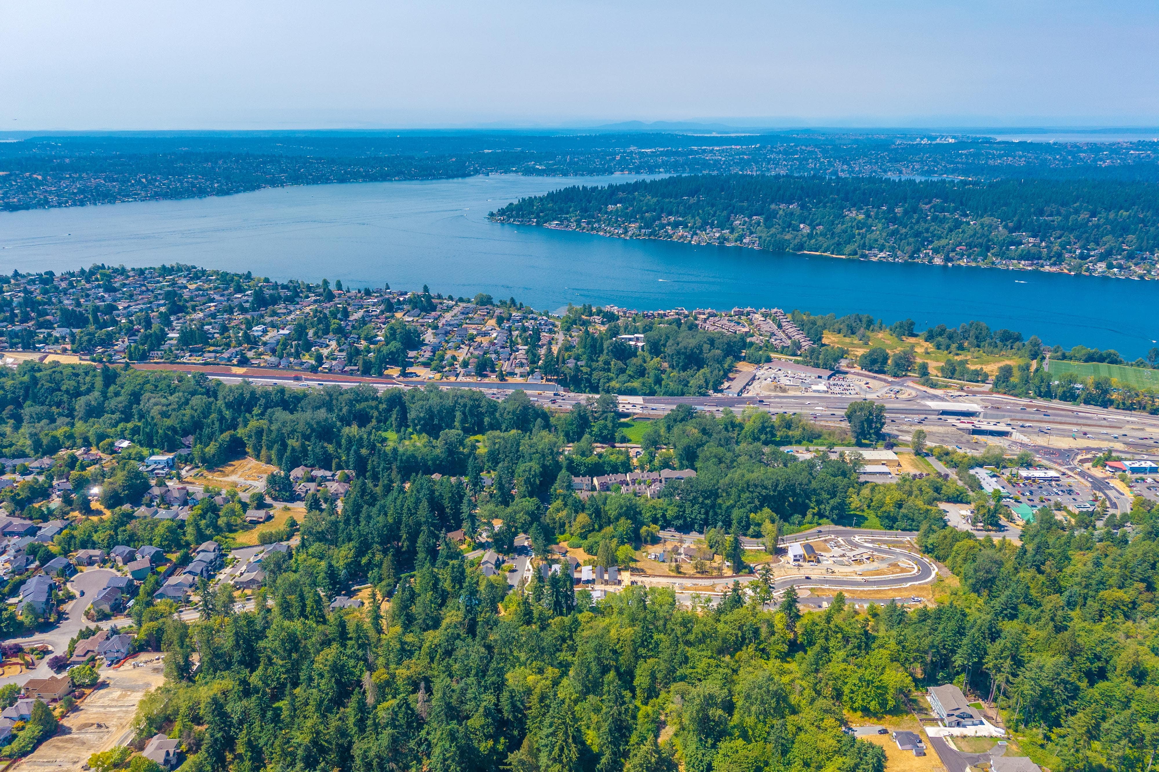 A city with trees and water in the background.