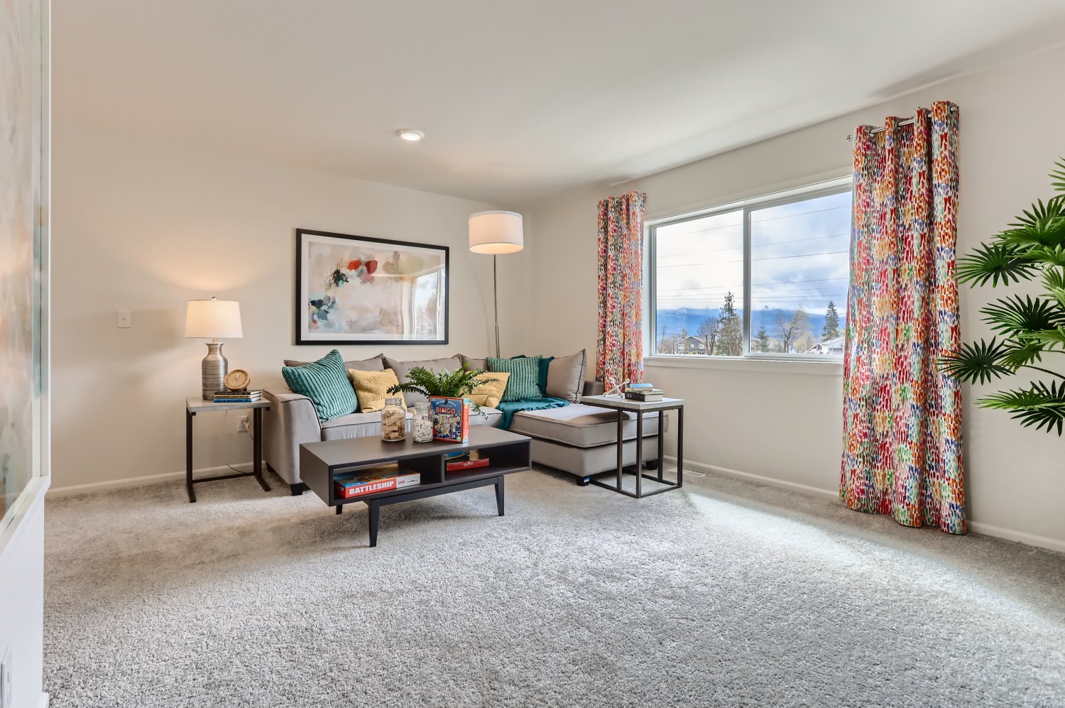 A living room with a large window.