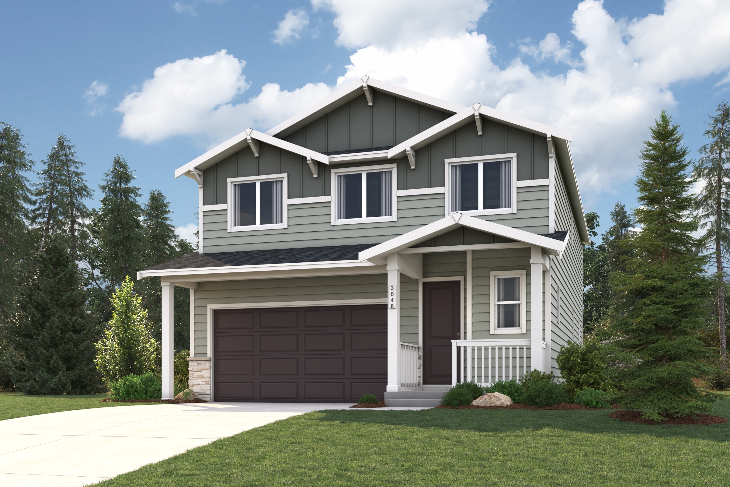 A house with a garage and trees around it.