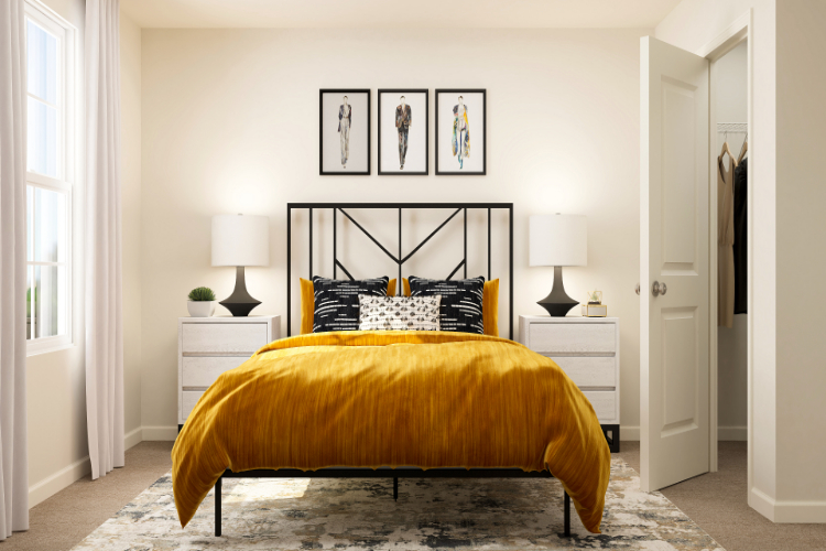 A bedroom with a bed and lamps.