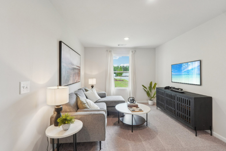 A living room with a couch and a coffee table.