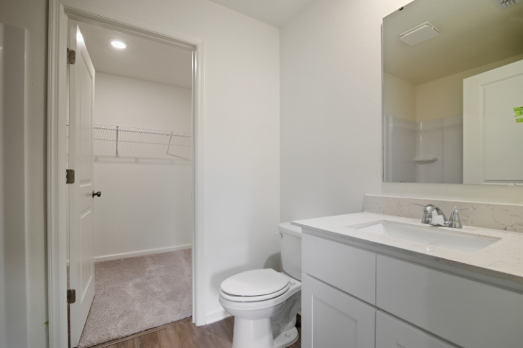 A bathroom with a sink toilet and shower.