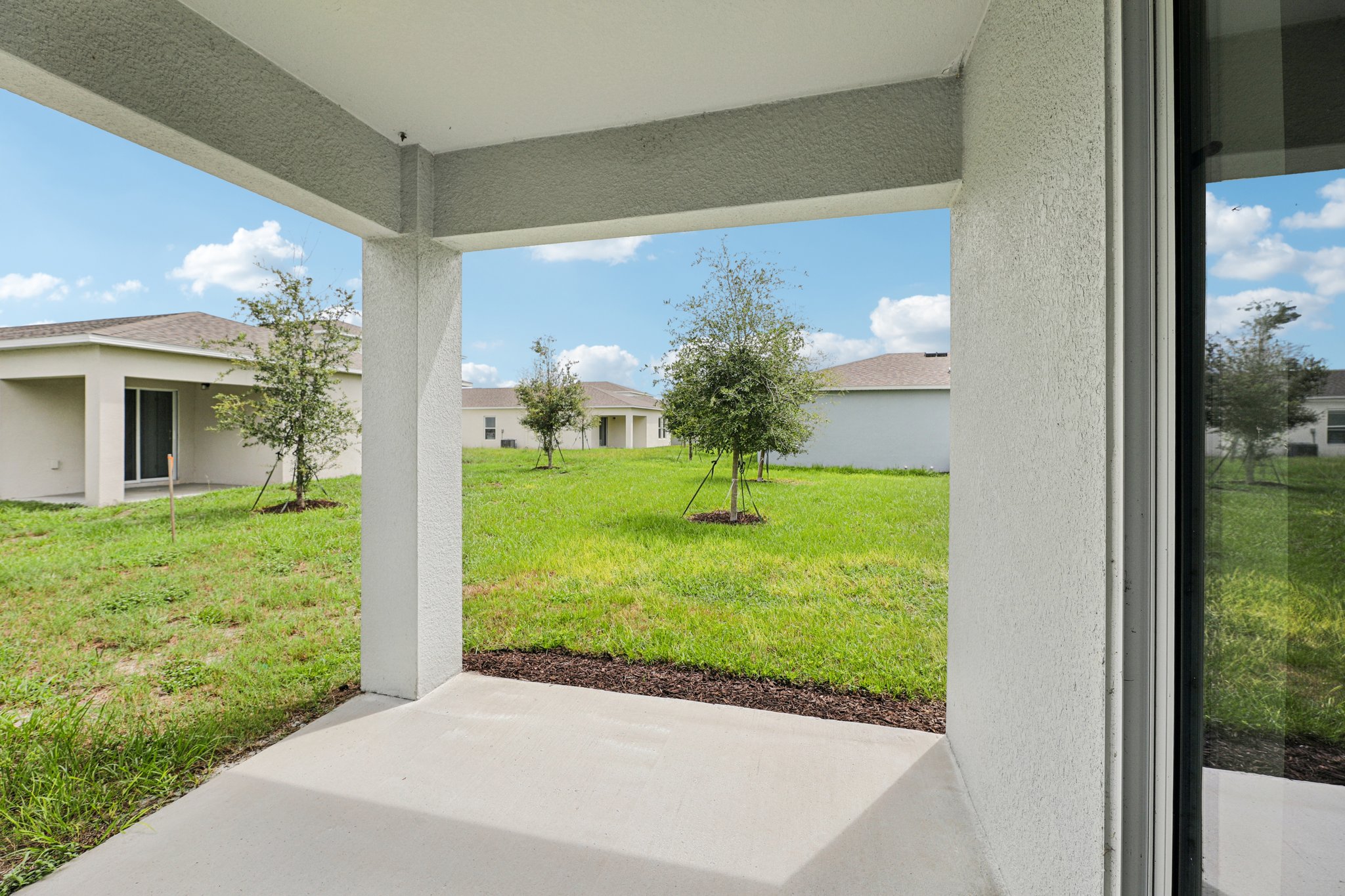 A view of a yard through a window.