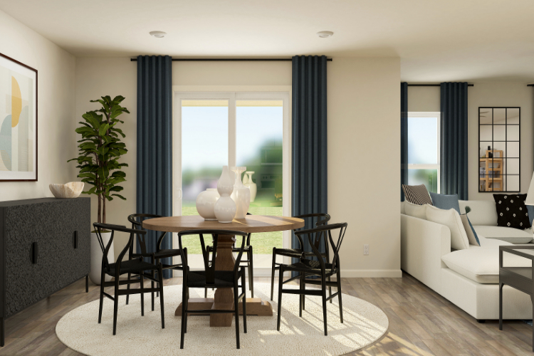A living room with a table and chairs.