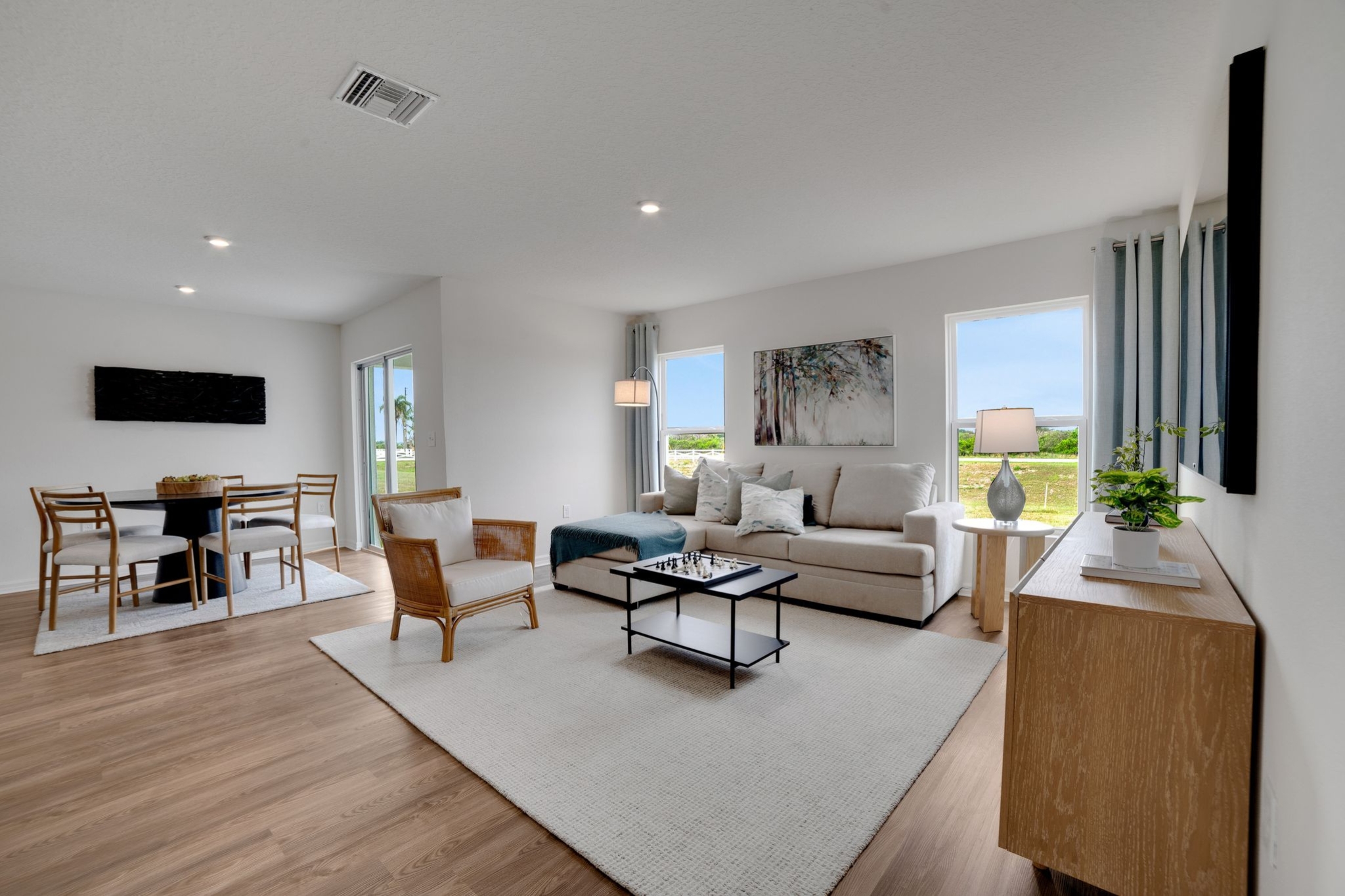 A living room with a wood floor.