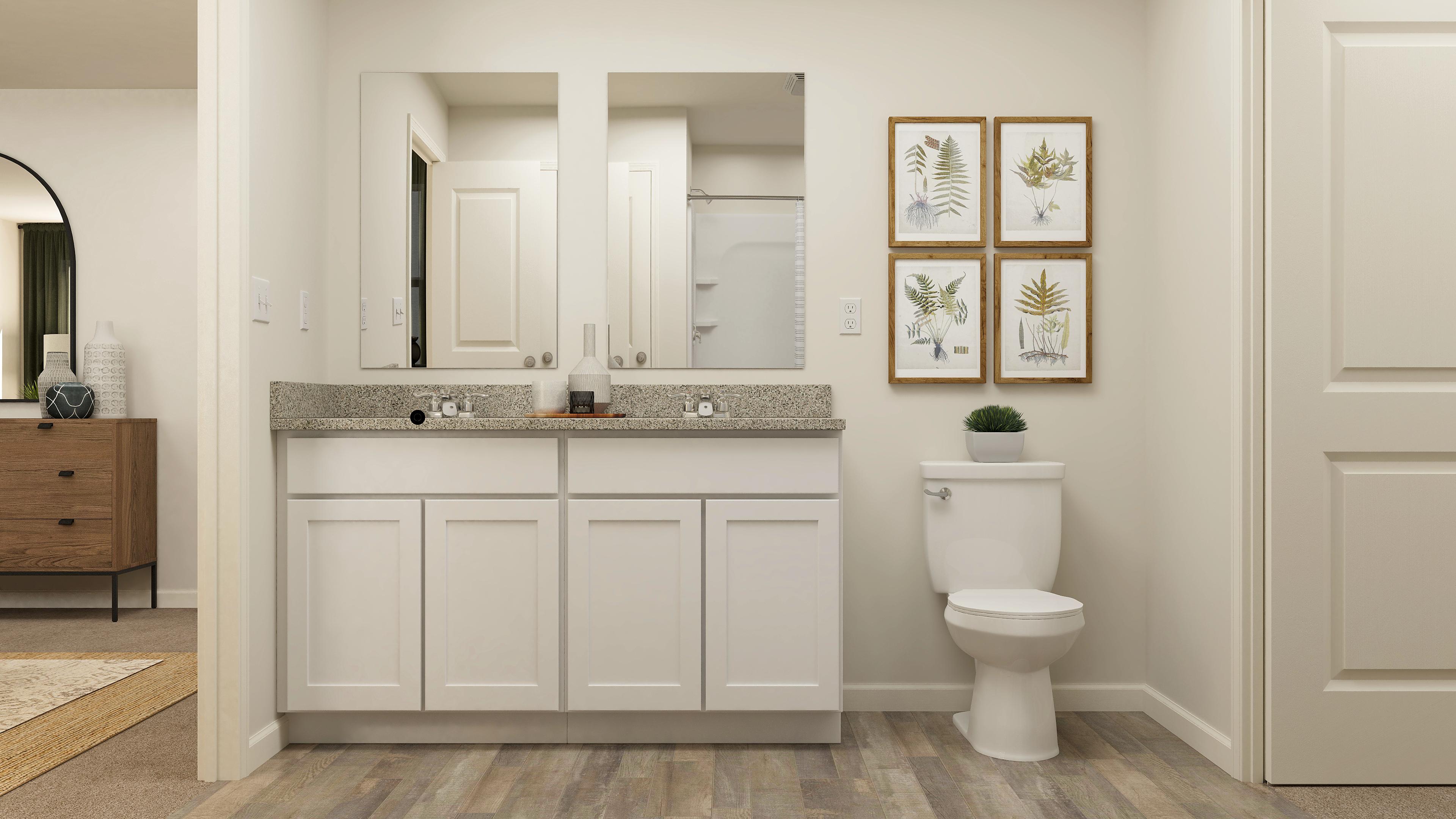 A bathroom with a toilet and a sink.