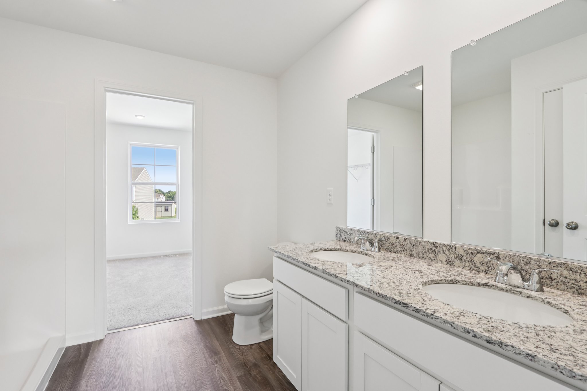A bathroom with a marble countertop.