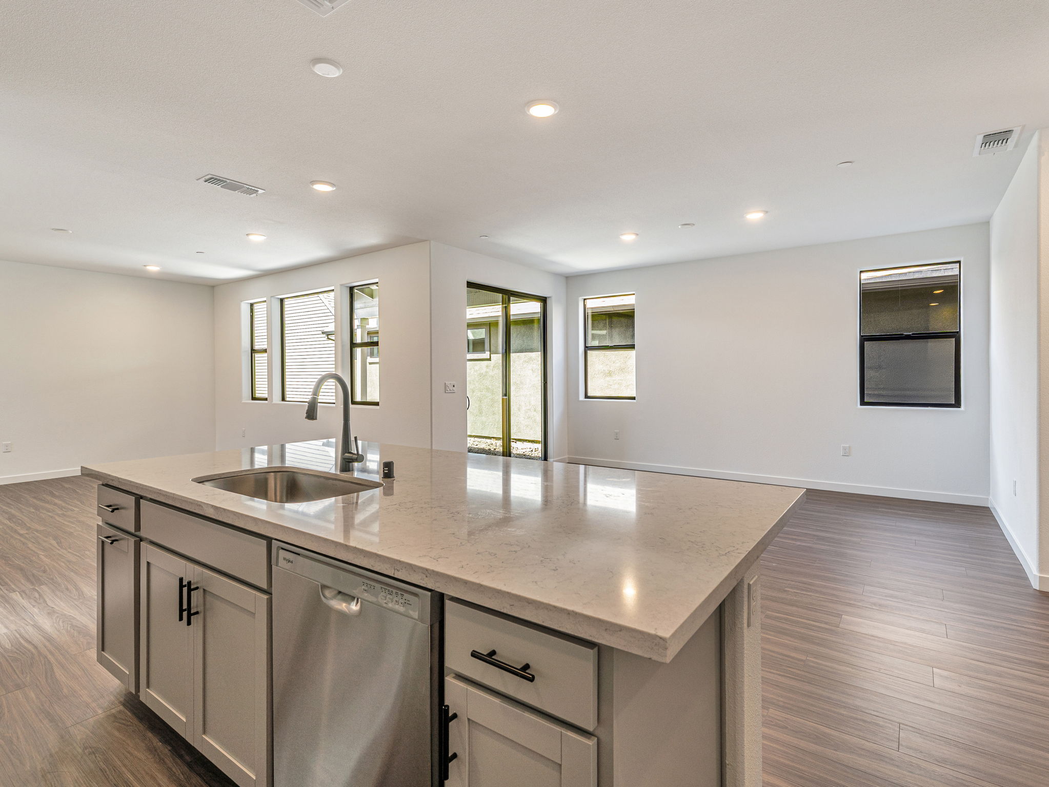 A kitchen with marble counters.